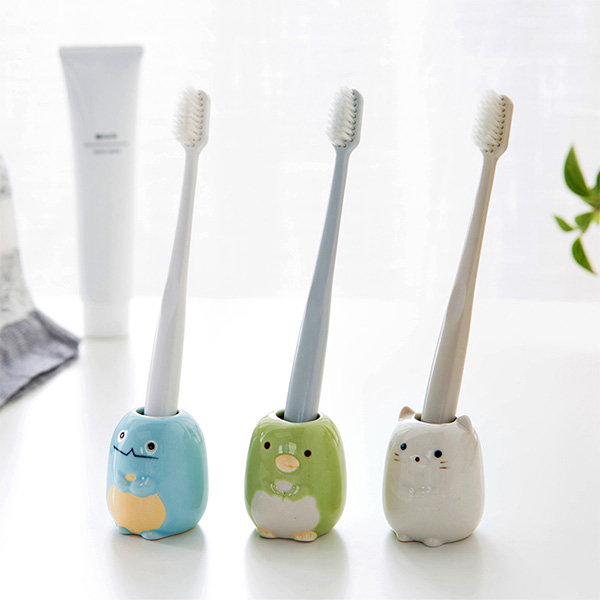 toothbrush holder with toothpaste dispenser