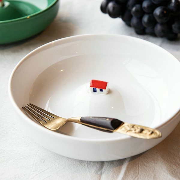 ceramic bowl with house in middle