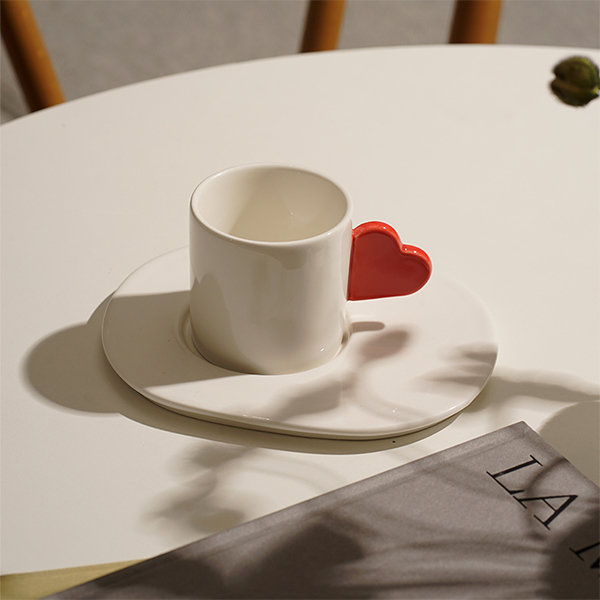 ceramic coffee cup and saucer