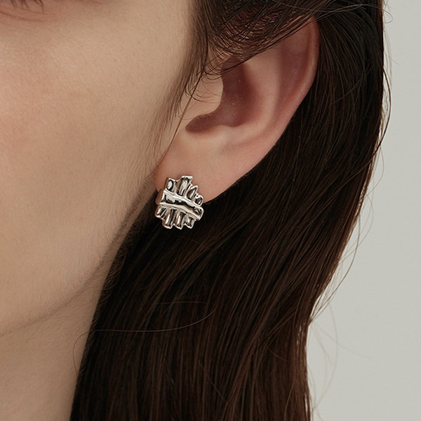 Premium Photo  Gold pierced earrings on background wood